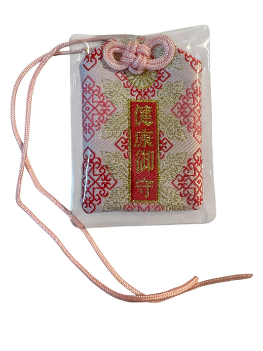 Omamori giallo chiaro e rosso “ASSISTENZA”