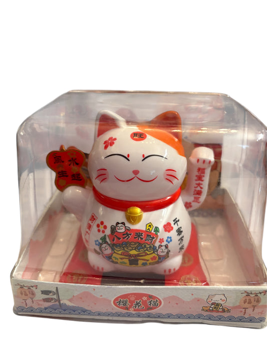 Maneki neko zampina che si muove con tavoletta rossa in mano