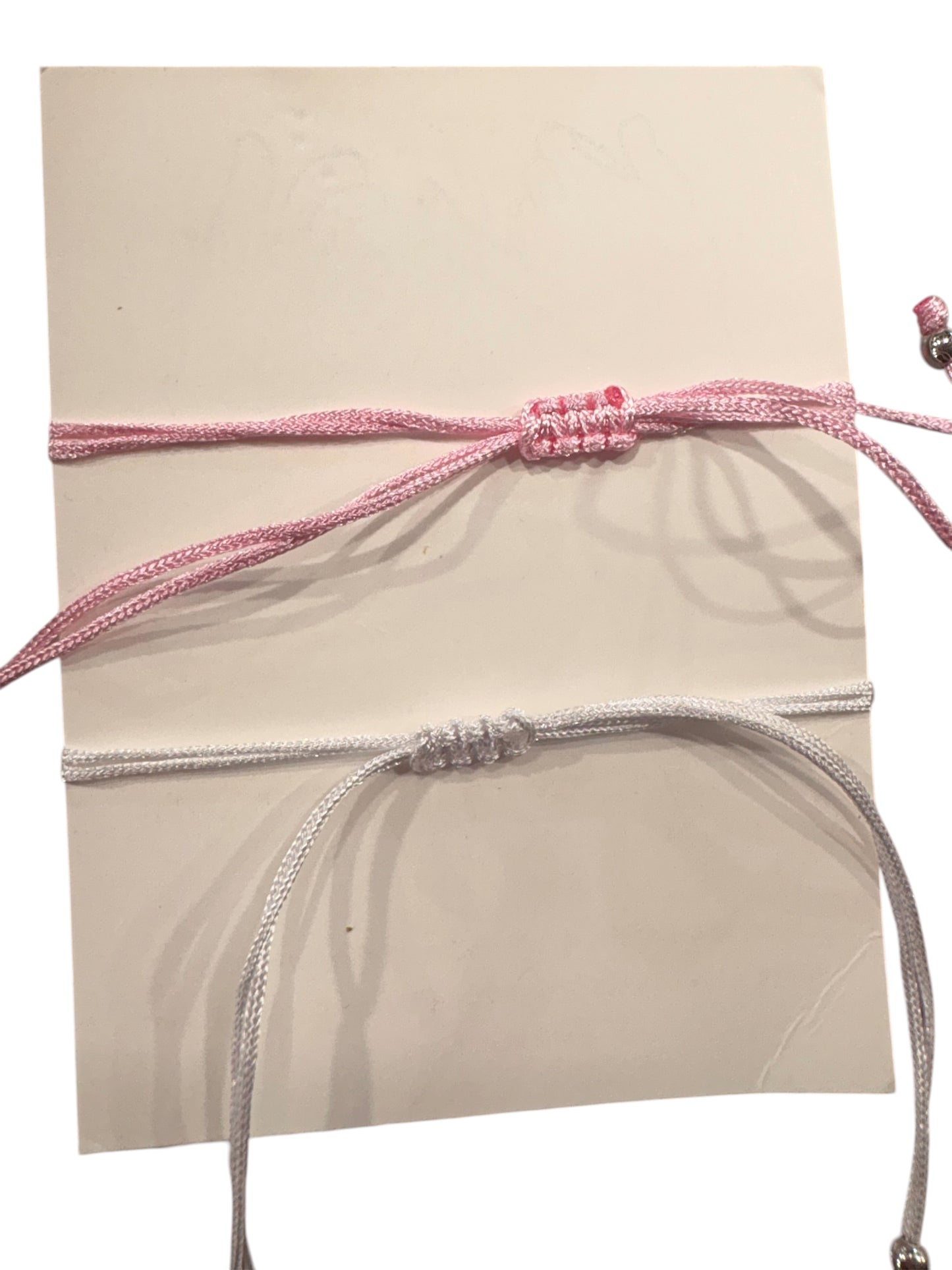 2 Bracciali Cuori magnetici in filo rosa e bianco